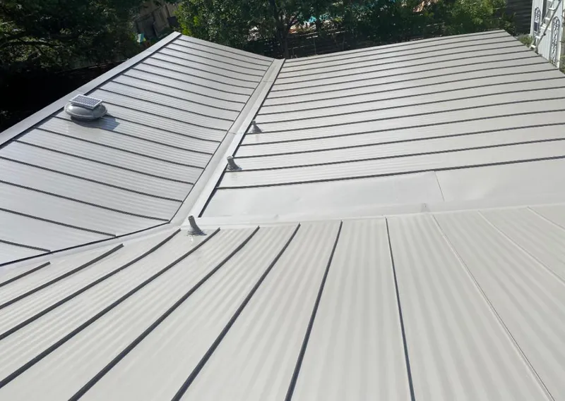 Solar attic fan installed on a metal roof for Roof Ventilation in Camino Tassajara